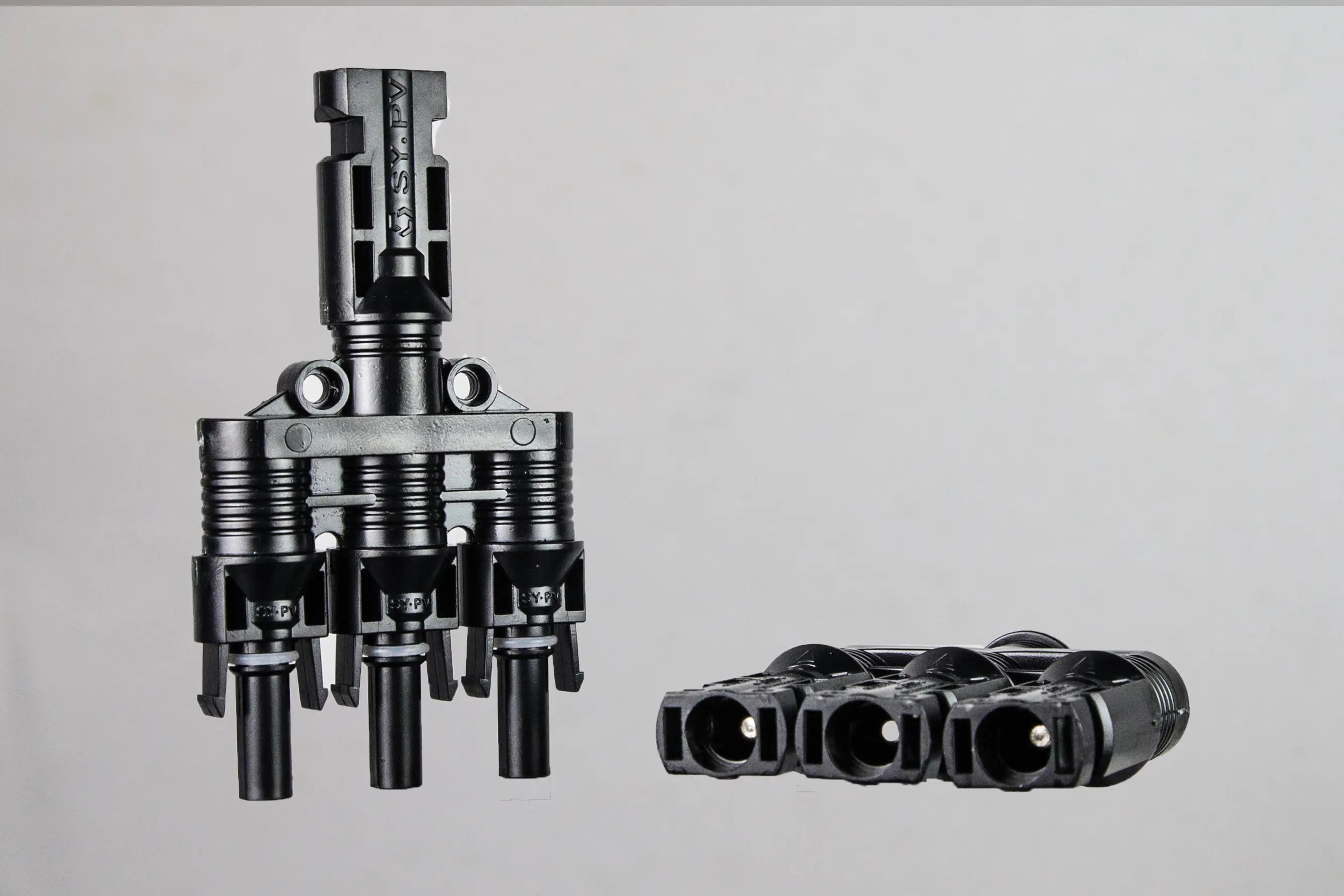 Close-up of PVconnectorpro BM31-A/B 1000V DC solar PV branch connector with female ports, male pins, and secure locking mechanism.