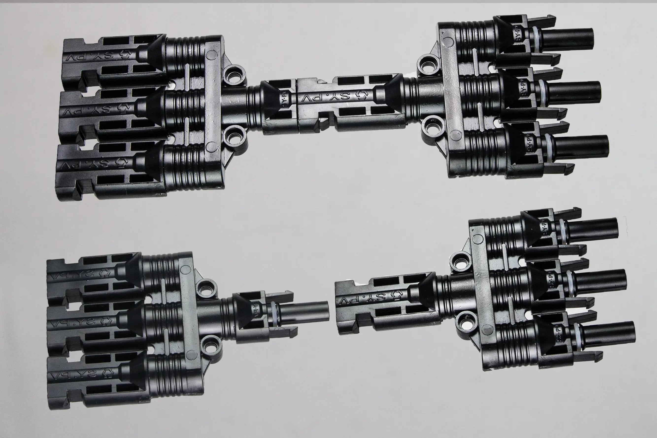 Close-up of PVconnectorpro BM31-A/B 1000V DC solar PV branch connector with three female inputs and one male output, waterproof design.